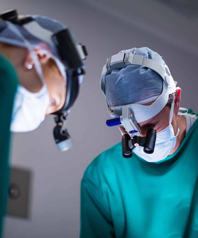 SERVICES_0001_surgeons-wearing-surgical-loupes-while-performing-operation